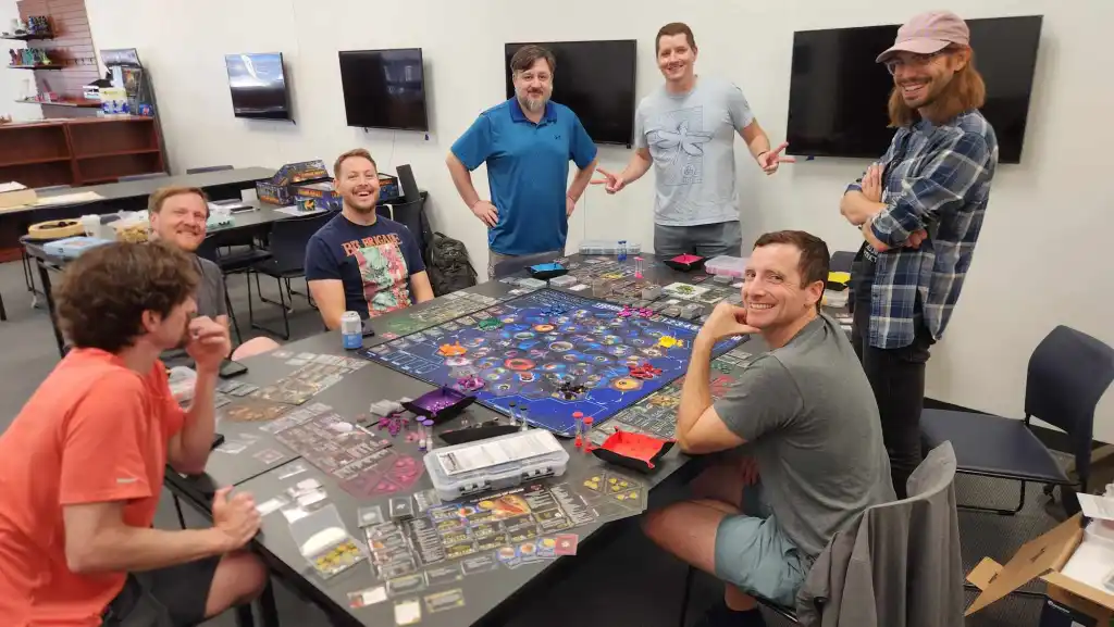 Group of friends playing a board game at Game Haven
